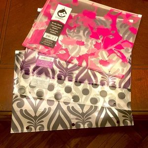 Set of four binder sleeve with zip closure. Different designs. From Studio C.